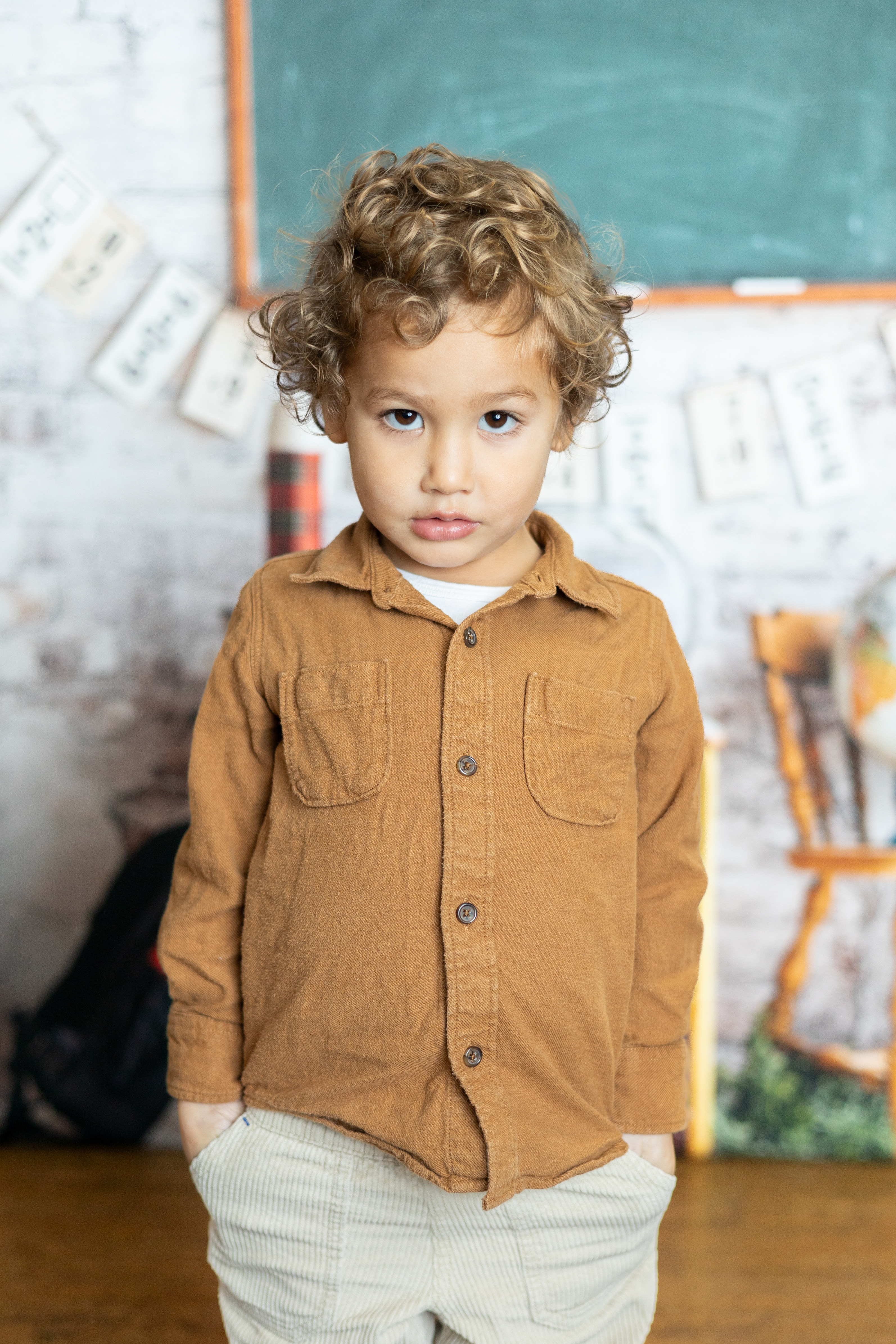 Portrait of Finn Jones, smiling in a classroom.